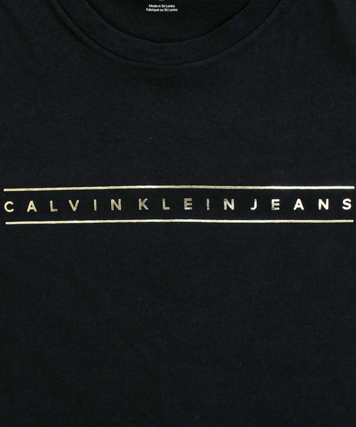 Calvin Klein(カルバン・クライン)の「CKJ ゴールドストライプ グラフィックTシャツ SS 30S CKJ GOLD STRIPE GRAPHIC TEE(Tシャツ/カットソー・メンズ・ホワイト/ブラック・XL/L/M)」の10枚目の写真