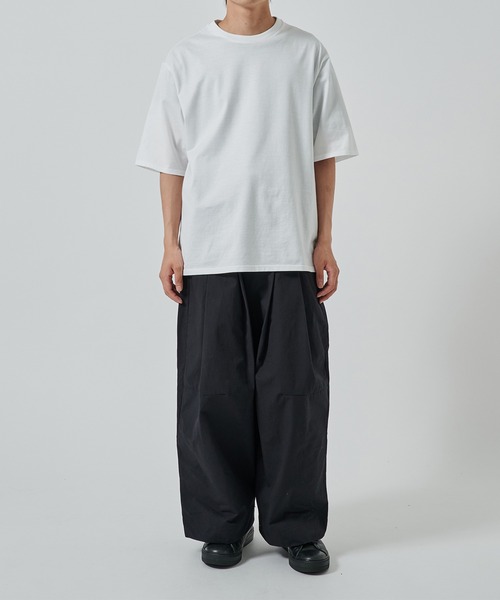 SHINYAKOZUKA（シンヤコヅカ）の「【SHINYAKOZUKA】別注 UPCYCLED BAGGY（チノパンツ・メンズ・ダークグリーン/ブラック・S/M）」の3枚目の写真