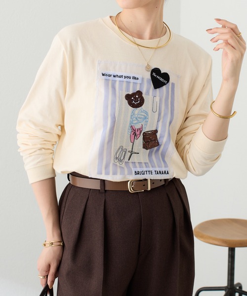 COLLAGE GALLARDAGALANTE(コラージュガリャルダガランテ)の「BRIGITTETANAKA×The NERDYS/コラボロンT(Tシャツ/カットソー・レディース・オフホワイト/ブラウン・S/L)」の1枚目の写真