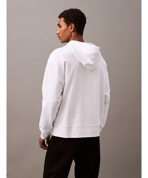 Calvin Klein（カルバン・クライン）の「【ユニセックス】リラックス ロゴ テリー パーカー（パーカー・メンズ・ホワイト/ブラック/グレー/レッド/グレー系/オレンジ系その他/ブラック系/ホワイト系/ヘザーグレー/ブルー系その他・S/M/L/XL/XS）」の19枚目の写真