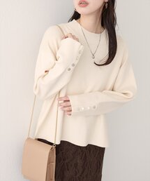 natural couture（ナチュラルクチュール）の「スタンドネック袖口釦ゆるニット（ニット/セーター）」