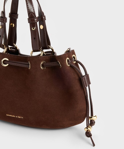 CHARLES & KEITH(チャールズ & キース)の「Moxieミニモキシードローストリングバケットバッグ(ショルダーバッグ・レディース・ダークブラウン・S)」の6枚目の写真