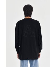 APOSTROPHE COMMA（アポストロフィコンマ）の「リフレクティブ ACO バックロゴ 長袖Tシャツ (ブラック)（Tシャツ/カットソー）」