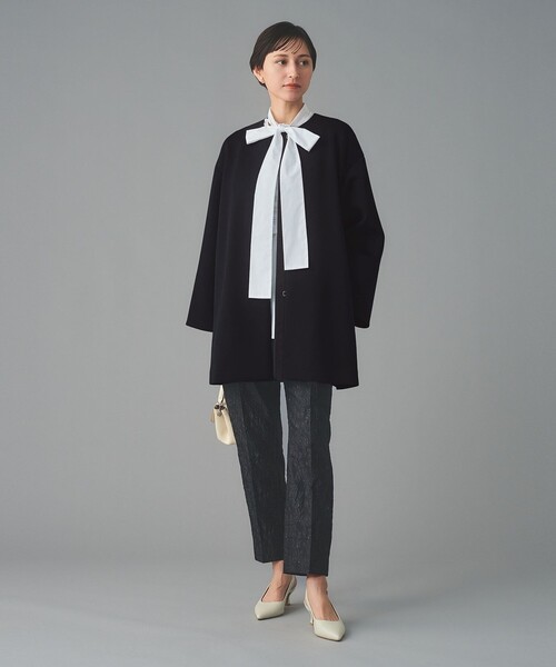 UNITED ARROWS(ユナイテッドアローズ)の「SPONGY Aライン ミドルコート(ノーカラーコート・レディース・ブラック/ネイビー・38/36)」の4枚目の写真