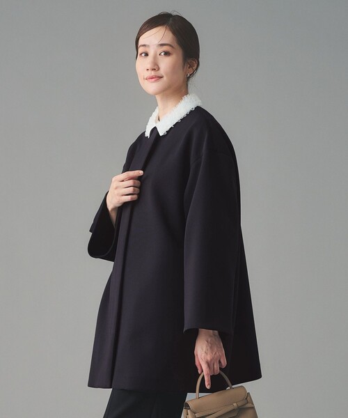 UNITED ARROWS(ユナイテッドアローズ)の「SPONGY Aライン ミドルコート(ノーカラーコート・レディース・ブラック/ネイビー・38/36)」の9枚目の写真