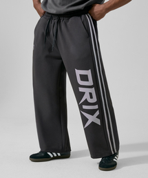DRIX（ドリックス）の「Track Line Graphic Wide Sweatpants_Charcoal（スウェットパンツ）」