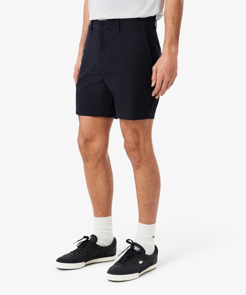 LACOSTE(ラコステ)の「ストレッチチノバミューダショーツ(その他パンツ・メンズ・ダークネイビー/モスグリーン・31/32)」の1枚目の写真