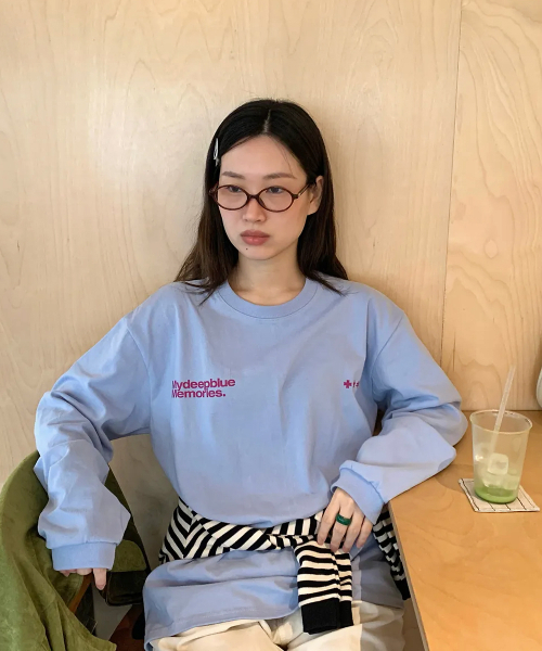 mydeepbluememories(マイディープブルーメモリーズ)の「MM SYMBOL LOGO LONG SLEEVE T(SKY)(Tシャツ/カットソー・レディース・スカイブルー・FREE)」の1枚目の写真