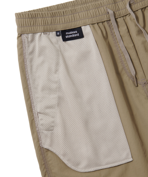 MUSINSA STANDARD（ムシンサスタンダード）の「ナイロンバンディングショーツ_7.5インチ [ベージュ]（その他パンツ・メンズ・その他・26）」の7枚目の写真