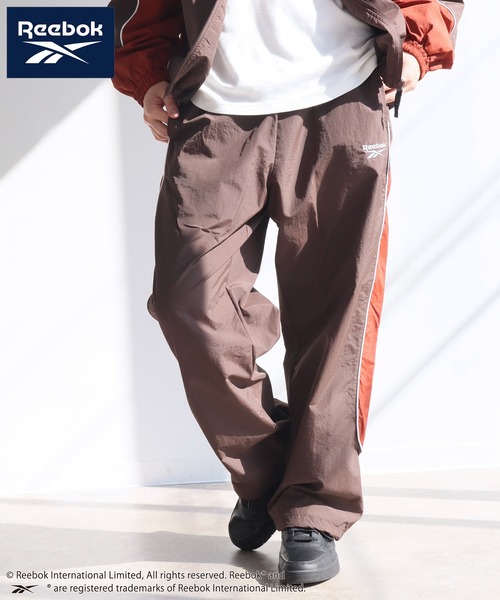 Reebok(リーボック)の「【Reebok/リーボック】パイピング デザイン ナイロン パンツ(その他パンツ・メンズ・ブラック/ネイビー/グリーン/ダークブラウン・M/L/LL)」の3枚目の写真