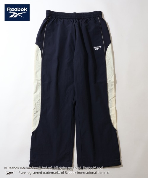 Reebok(リーボック)の「【Reebok/リーボック】パイピング デザイン ナイロン パンツ(その他パンツ・メンズ・ブラック/ネイビー/グリーン/ダークブラウン・M/L/LL)」の4枚目の写真