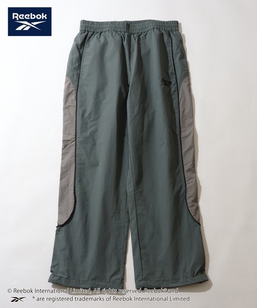Reebok(リーボック)の「【Reebok/リーボック】パイピング デザイン ナイロン パンツ(その他パンツ・メンズ・ブラック/ネイビー/グリーン/ダークブラウン・M/L/LL)」の1枚目の写真
