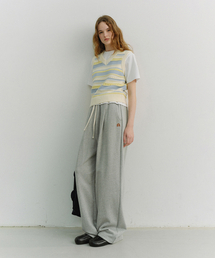 DUNST（ダンスト）の「UNISEX LEATHER LOGO WIDE SWEAT PANTS_UDPA6A102_MELANGE GREY（スウェットパンツ）」