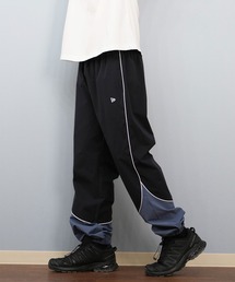 NEW ERA（ニューエラ）の「NEW ERA/ニューエラオーバーサイズド パイピング トラックパンツ ロンパン セットアップ対応 14674815/14674816（その他パンツ・レディース）」