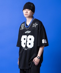 a.p.o.v. ナンバリンググラフィックロゴプリントポンチスウェットフットボールTシャツ