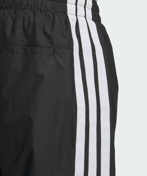 adidas(アディダス)の「スリーストライプス ルーズフィット 起毛トリコット裏地付き フルレングス オープンヘム ウィンドパンツ / アディダス adidas(その他パンツ・メンズ・ブラック・XX-LARGE/3XL/LARGE/MEDIUM/SMALL/X-LARGE/X-SMALL)」の4枚目の写真