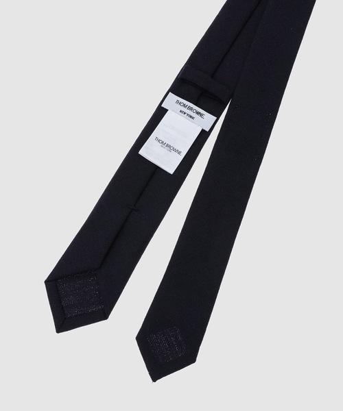 THOM BROWNE(トムブラウン)の「CLASSIC TIE W/ GG APPLICATION IN 2 PLY CRISPY WOOL SUITING(ネクタイ・メンズ・グレー/ネイビー・ONE SIZE)」の4枚目の写真