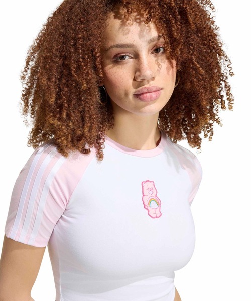adidas(アディダス)の「adidas CARE BEARS BABY TEE / アディダス ケアベア ベビー Tシャツ(Tシャツ/カットソー・レディース・ホワイト×ピンク・L/M/S)」の2枚目の写真