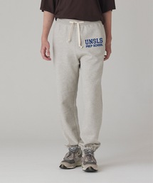 UN-USELESS（アンユースレス）の「【UN-USELESS】アンユースレス/ UNSLS PREP LOGO SWKNIT PANTS（スウェットパンツ）」