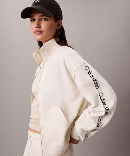 Calvin Klein（カルバン・クライン）の「ロゴテープフルシップジャケット（スウェット・レディース・オフホワイト/ネイビー・XS/M/S）」の5枚目の写真