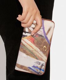 COACH（コーチ）の「【COACH X MINT + SERF】アコーディオン ジップ ウォレット・シグネチャー キャンバス（財布・メンズ）」