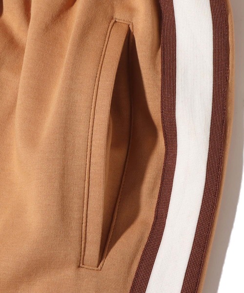 UGG ブラウン ロゴ入り パンツ UGG (アグ) 裏ボア ロゴ ロングパンツ Bonded fleece pant