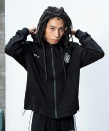 Glanss（グランス）の「glanss emblem zip-up hoodie / エンブレム刺繍ユニフォームジップパーカー 裾ドローコード付【ユニセックス】（パーカー）」