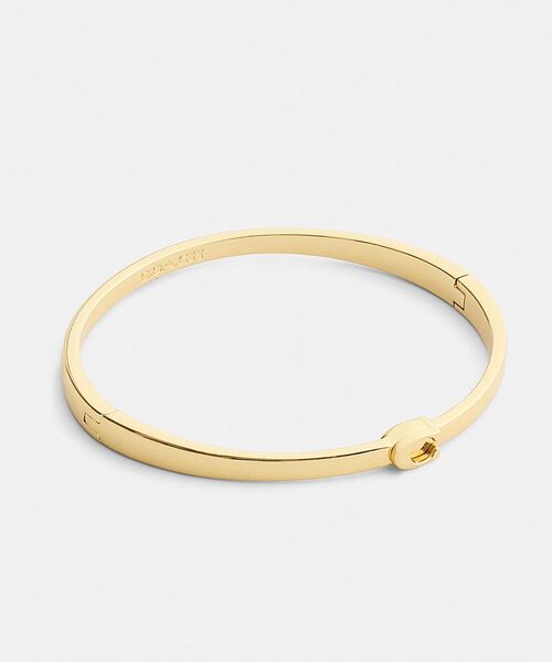 COACH(コーチ)の「シン シグネチャー ヒンジド バングル(バングル/リストバンド・レディース・ゴールド系その他・ONE)」の2枚目の写真