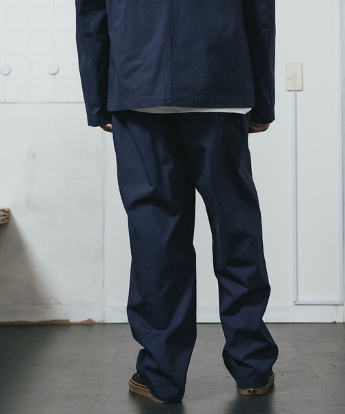 POP TRADING COMPANY(ポップトレーディングカンパニー)の「POP TRADING COMPANY/ポップトレーディングカンパニー HEWITT SUIT PANT テーパードパンツ 刺繍 ブランドロゴ(チノパンツ・メンズ・ネイビー・L/XL/M)」の4枚目の写真