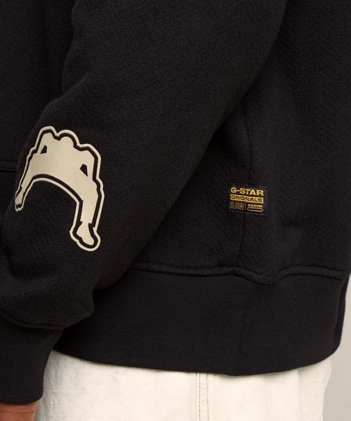セール】MULTI LOGO LOOSE HOODED SWEATER/マルチグラフィック