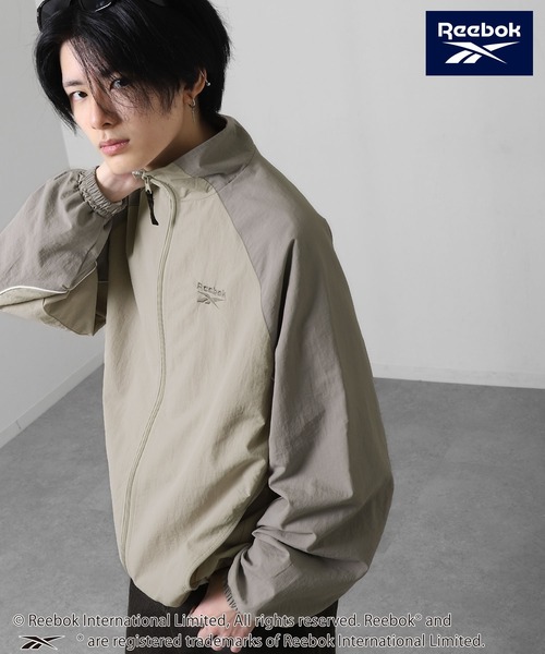 Reebok(リーボック)の「【REEBOK】 ラグラン 袖ライン パイピング ドロスト ナイロンジャケット(ナイロンジャケット・レディース・サックスブルー/グレイッシュベージュ/ブラック・MEDIUM/LARGE/X-LARGE)」の12枚目の写真