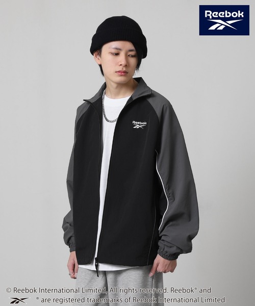 Reebok(リーボック)の「【REEBOK】 ラグラン 袖ライン パイピング ドロスト ナイロンジャケット(ナイロンジャケット・レディース・サックスブルー/グレイッシュベージュ/ブラック・MEDIUM/LARGE/X-LARGE)」の7枚目の写真