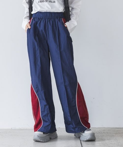 JEANASIS(ジーナシス)の「メッシュキリカエトラックパンツ/108707(その他パンツ・レディース・ホワイト系その他/レッド系その他/ネイビー系・FREE)」の1枚目の写真