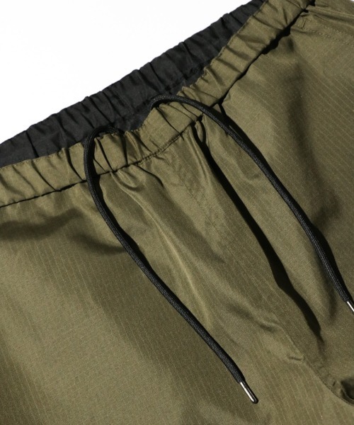 TAION(タイオン)の「TAION / タイオン NON DOWN MILITARY REVERSIBLE WIDE PANTS (TAION-R139NDML-1) ミリタリー ワイド バギーパンツ(その他パンツ・メンズ・ブラック/オリーブ/その他1/ダークネイビー・MEDIUM/LARGE/X-LARGE)」の6枚目の写真