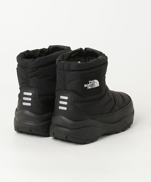 THE NORTH FACE(ザノースフェイス)の「ザ ノース フェイス THE NORTH FACE K Nuptse Bootie Logo Short_キッズ ヌプシ ブーティ ロゴ ショート(ブーツ・キッズ・ブラック・20.0cm/21.0cm/22.0cm/17.0cm/18.0cm/19.0cm)」の2枚目の写真