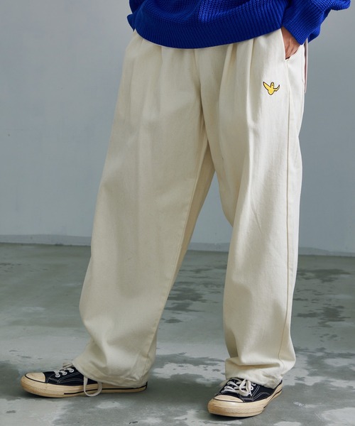 (What it isNt)ART BY MARKGONZALES(ワットイットイズント)の「『(What it isNt) ART BY MARK GONZALES/アートバイマークゴンザレス』スケートロングパンツ(その他パンツ・メンズ・ブラック/オフホワイト・XL/L/M)」の1枚目の写真