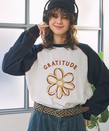 MONO-MART LADY'S（モノマートレディース）の「配色ステッチ×フラワーグラフィックプリント ラグラン 長袖Tシャツ（Tシャツ/カットソー・メンズ）」