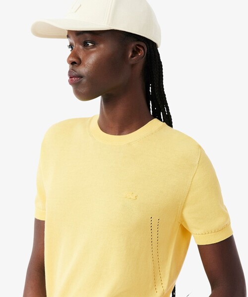LACOSTE(ラコステ)の「透かし編み シームレス3Dニット半袖セーター(ニット/セーター・レディース・ネイビー/イエロー・40/38/36/34)」の1枚目の写真