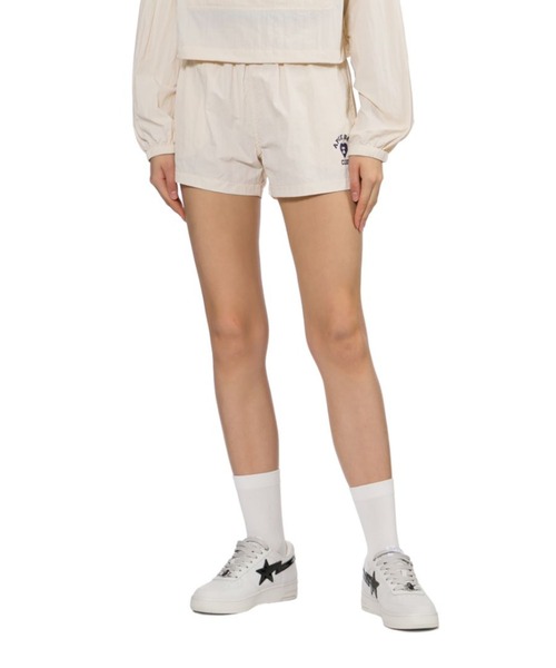 A BATHING APE（アベイシングエイプ）の「RUBBER PRINTED LOGO NYLON TRAINING SHORTS（その他パンツ・レディース・アイボリー/ネイビー・X-SMALL/SMALL）」の5枚目の写真