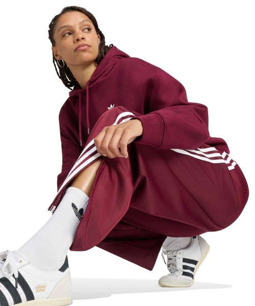adidas(アディダス)の「adidas FIREBIRD BARREL TRACK PANTS / アディダス ファイヤーバード バレル トラックパンツ(その他パンツ・レディース・バーガンディー・L/M/S)」の2枚目の写真