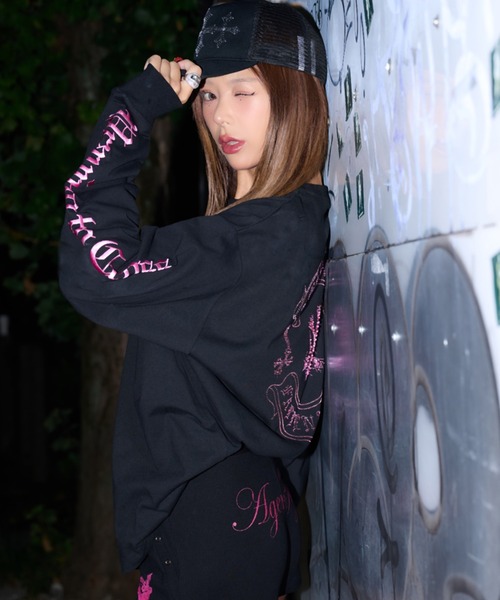 A'GEM9(エージェムナイン)の「A'GEM/9 × .kom 『A'GEM/9/エージェムナイン』ラインストーンロゴロングスリーブ(Tシャツ/カットソー・レディース・ホワイト/ブラック・FREE)」の6枚目の写真