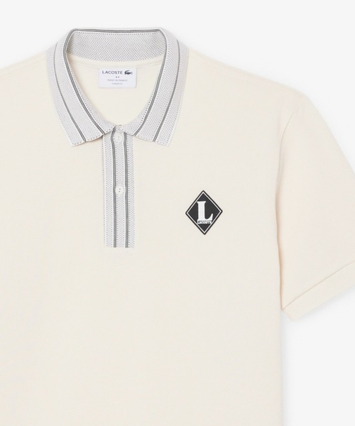 LACOSTE(ラコステ)の「ヘビーオンス鹿の子 フランスメイド レトロパッチポロシャツ(ポロシャツ・メンズ・オフホワイト・2/4/3/5)」の1枚目の写真
