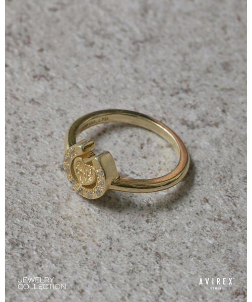 AVIREX(アヴィレックス)の「HEART HORSESHOE CZ RING(GOLD)by J.H.M CO.,LTD.(リング・レディース・ゴールド・12/15 )」の1枚目の写真