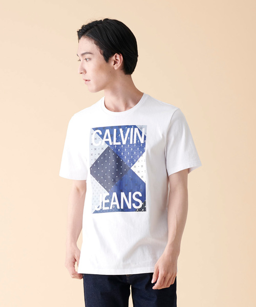 Calvin Klein Jeans(カルヴァンクラインジーンズ)の「パッチワーク プリント Tシャツ(Tシャツ/カットソー・メンズ・ホワイト・S/M/L/XL)」の1枚目の写真