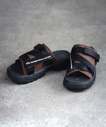 MEI（メイ）の「【MEI メイ】Lady's RECYCLED NYLON COVER SANDAL リサイクルナイロン ロゴテープ カバーサンダル 厚底 シャークソール（サンダル）」