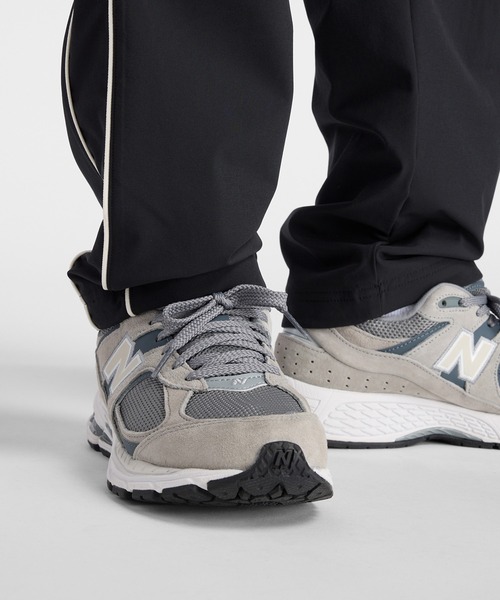 NEW BALANCE（ニューバランス）の「ウーブントラックパンツ 裏トリコット起毛（スウェットパンツ・メンズ・ブラック/ネイビー・MEDIUM/SMALL/XX-LARGE/X-LARGE/LARGE）」の21枚目の写真