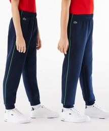LACOSTE（ラコステ）の「サイドライン 配色パイピングトラックパンツ（その他パンツ）」