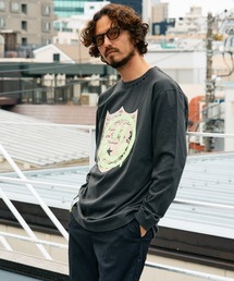 STUD MUFFIN（スタッドマフィン）の「STUD MUFFIN/スタッドマフィン/5.6ozコットン天竺 ラベルスマイル発泡プリント LS Tシャツ（Tシャツ/カットソー）」