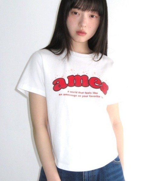 AMESWORLDWIDE(アメスワールドワイド)の「A'GEM/9 × .kom 『AMESWORLDWIDE/アメスワールドワイド』SHINING AMES ROUND HEM CROP TEE/シャイニングロゴラウンドヘムクロップ Tシャツ(Tシャツ/カットソー・レディース・ホワイト/チャコールグレー/ブルー・FREE)」の2枚目の写真