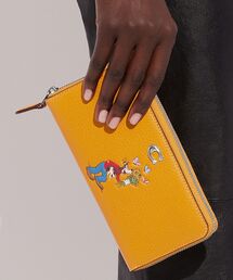 「DISNEY X COACH アコーディオン ジップ ウォレット・グーフィー」 Disney（ディズニー）の「【DISNEY X COACH】アコーディオン ジップ